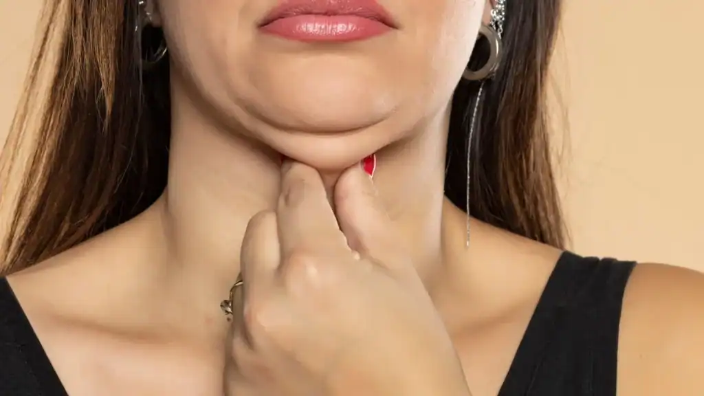 An image of a woman with double chin, sad, worried : Non Surgical Double Chin Removal Treatment in Pollokshields, UK